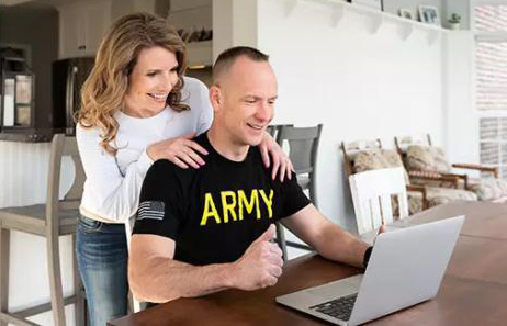 Army veteran looking at his laptop